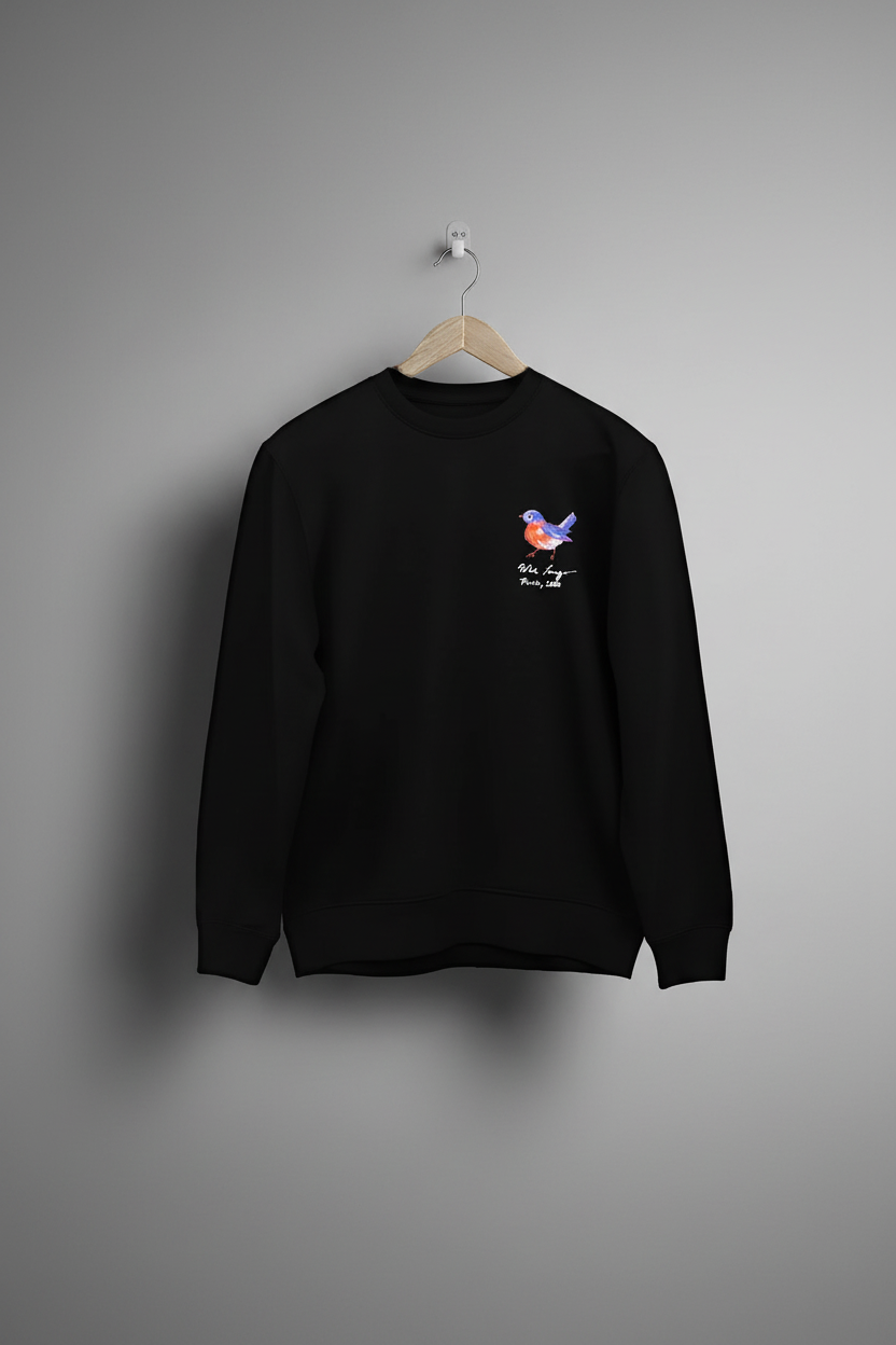 Black sweatshirt front hanging on grey wall